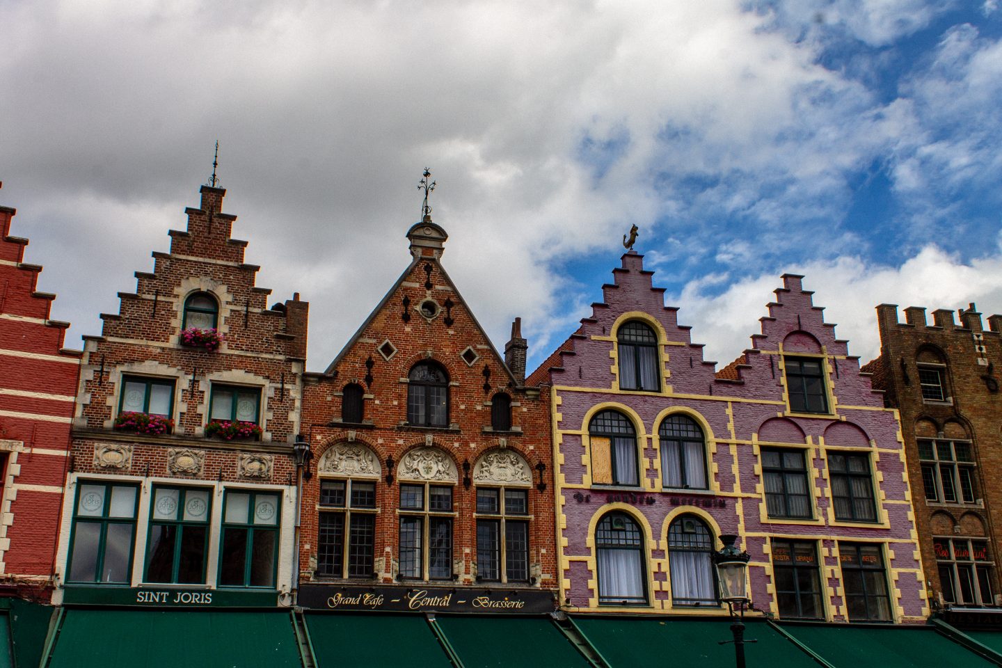 Belgium Quotes: Photo of the famous colourful houses in Grote markt in Bruges. 