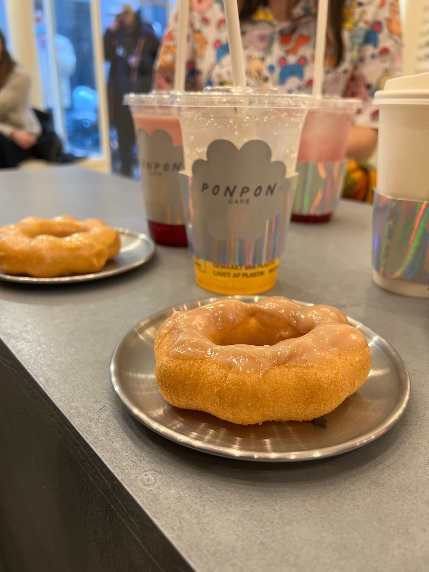 Cute Japanese Café style in Paris, a glazed doughtnuts and drinks.